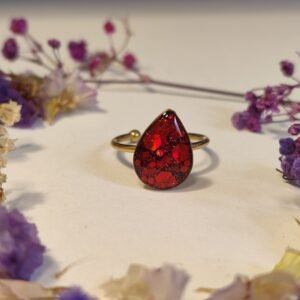 Anillo ajustable de acero inoxidable con PURPURINA HOLOGRÁFICA encapsulada en resina.