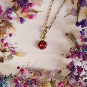 Colgante de acero inoxidable PURPURINA HOLOGRÁFICA encapsulada en resina.